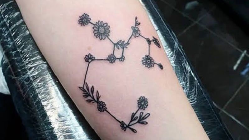 Sagittarius constellation with various symbols instead of stars inked on  the left upper arm  Constellation tattoos Sagittarius tattoo Sagittarius  tattoo designs